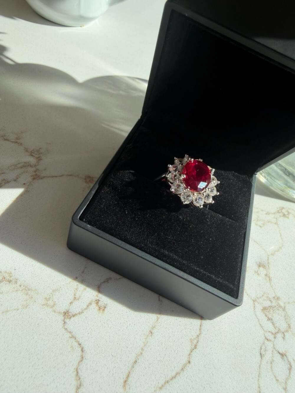 6.5kt pigeon blood Ruby and White saphire Halo Cluster Ring in Sterling